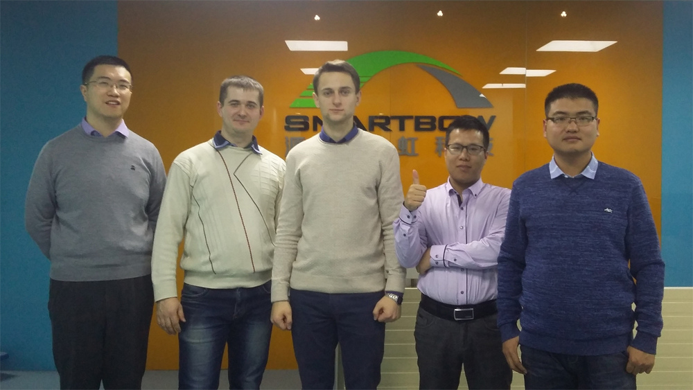 Siarhei Vasiukevich and Roman Tolkach with Smartbow colleagues