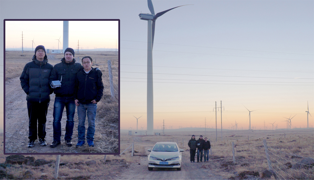 Siarhei Vasiukevich with Smartbow colleagues and the view of the wind farm